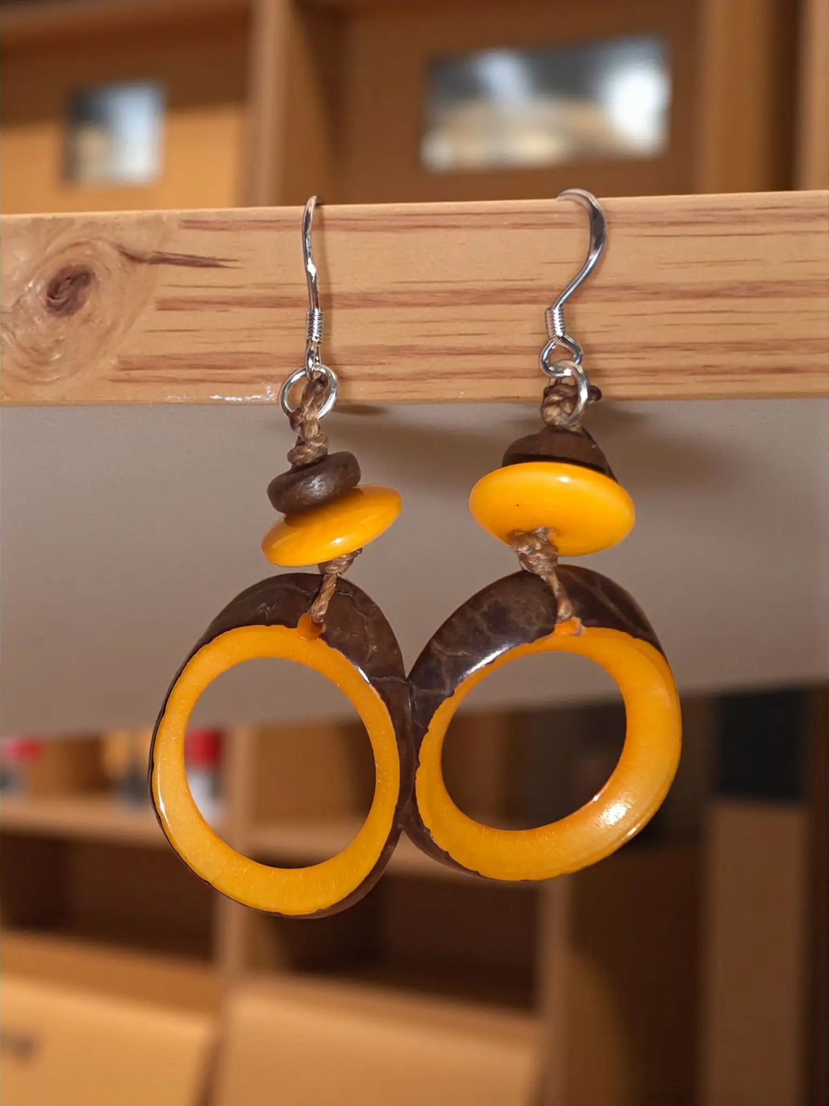 Pumpkin crush natural edge hoop dangle tagua earrings with handcrafted yellow and dark brown coconut shell rings and wood grain texture