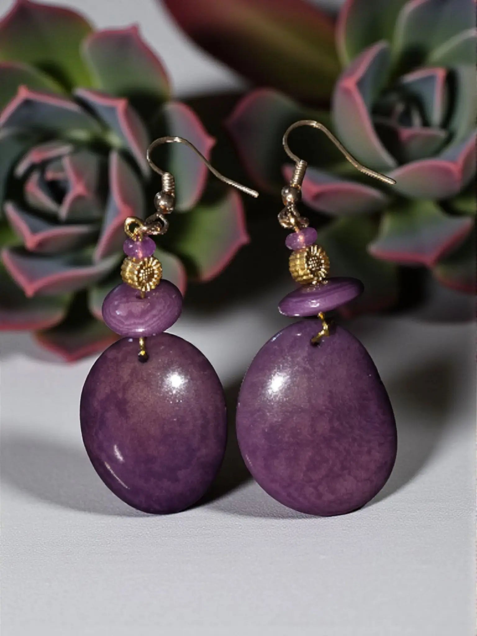 Purple beautiful grain tagua rainforest oval stone earrings with gold-tone sunflower accent and decorative bead