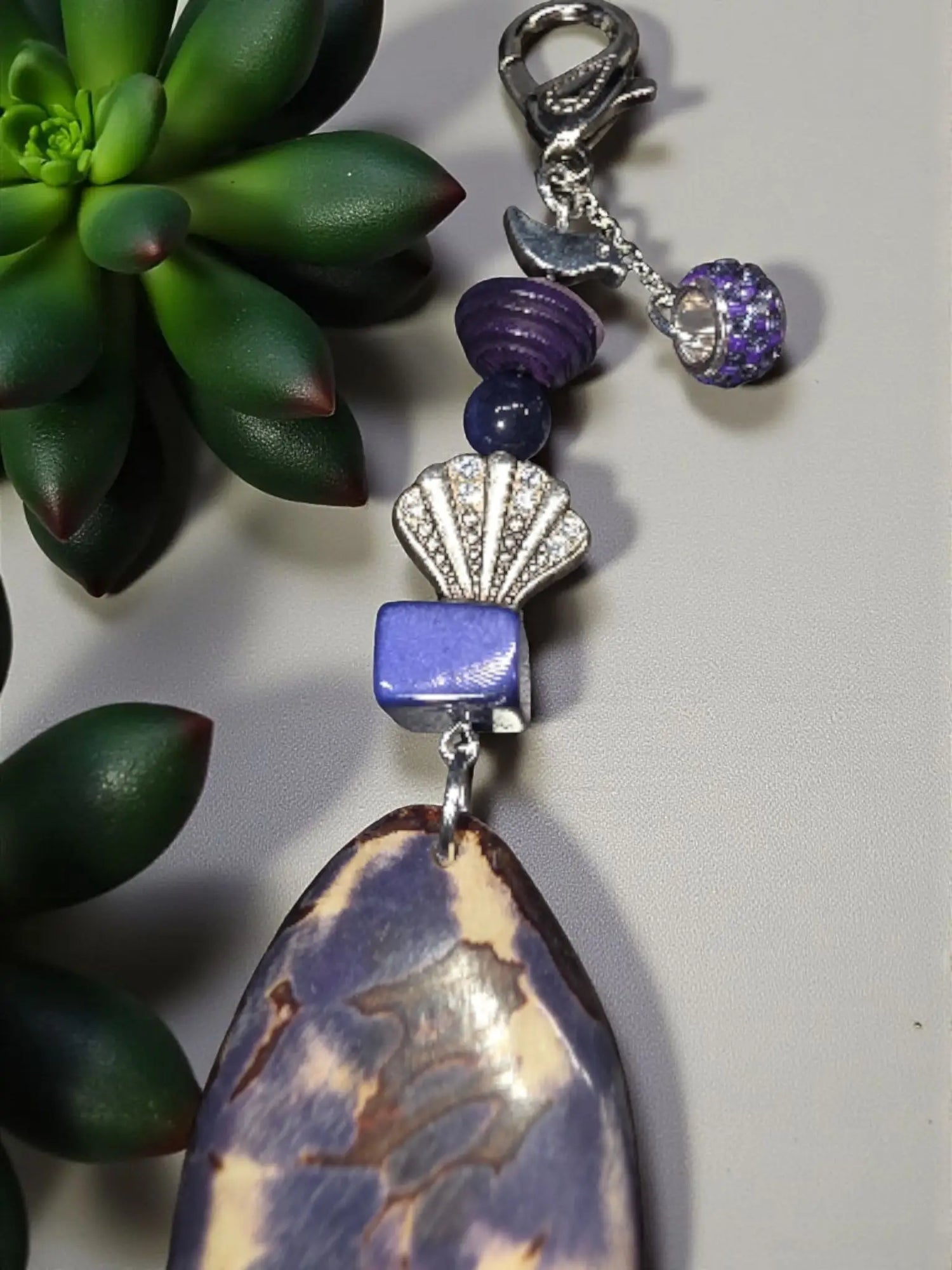 Purple natural carved tagua bag charm with marbled pendant silver shell charm blue bead and crystal accent