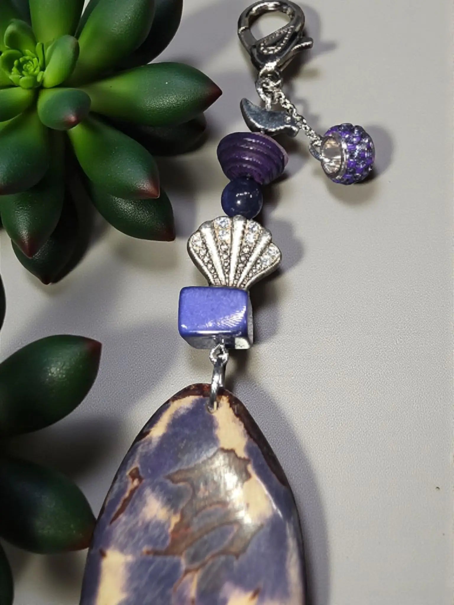 Purple natural carved tagua bag charm with marbled pendant silver shell charm blue bead and crystal accent