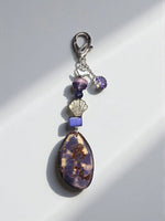 Purple natural carved tagua bag charm with bird pendant brown patterned stone silver clasp shell charm and purple rhinestone