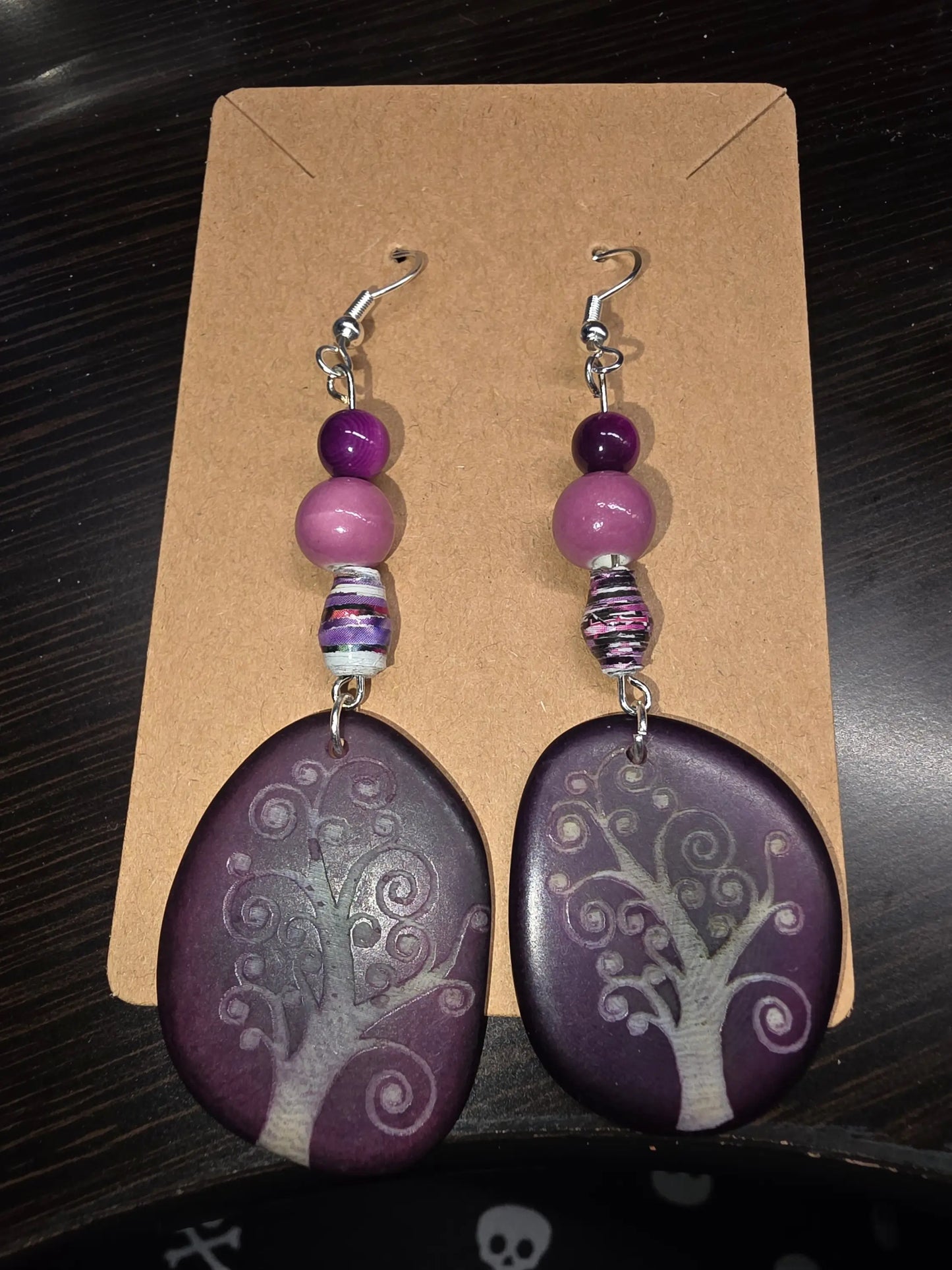 Purple swirly tree engraved tagua slice earrings with purple tree-of-life pendant, layered beads, and silver hooks