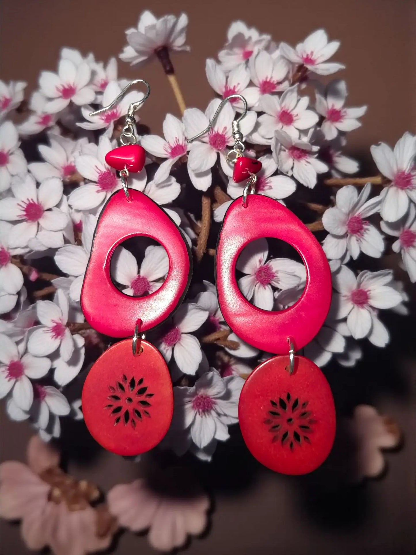 Red raspberry hoop earrings with vibrant red glossy shell and laser flower engraved teardrop and oval cutouts