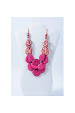 Remy vibrant tagua necklace featuring fuchsia and coral layered resin oval pendants with loop accents
