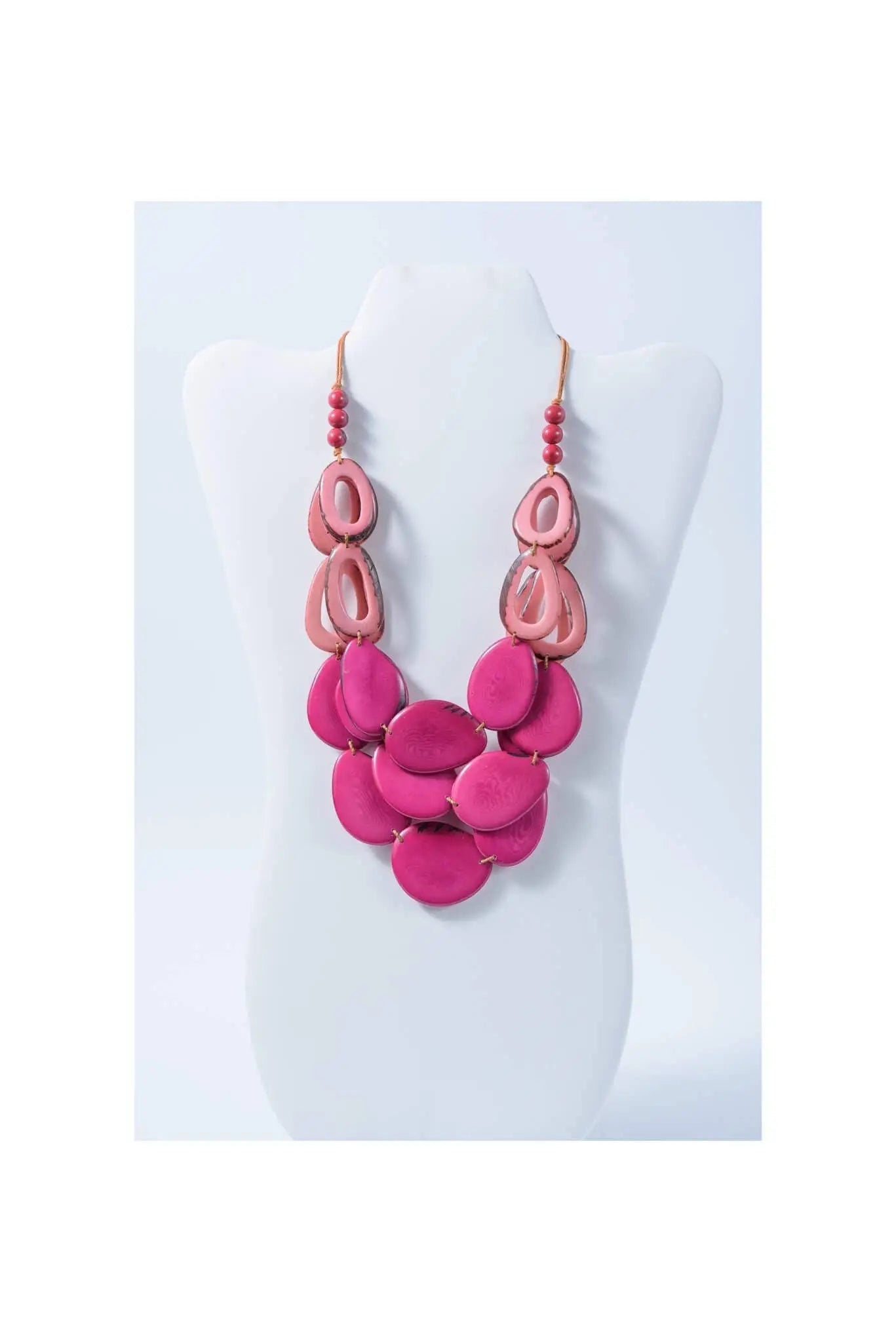 Remy vibrant tagua necklace featuring fuchsia and coral layered resin oval pendants with loop accents