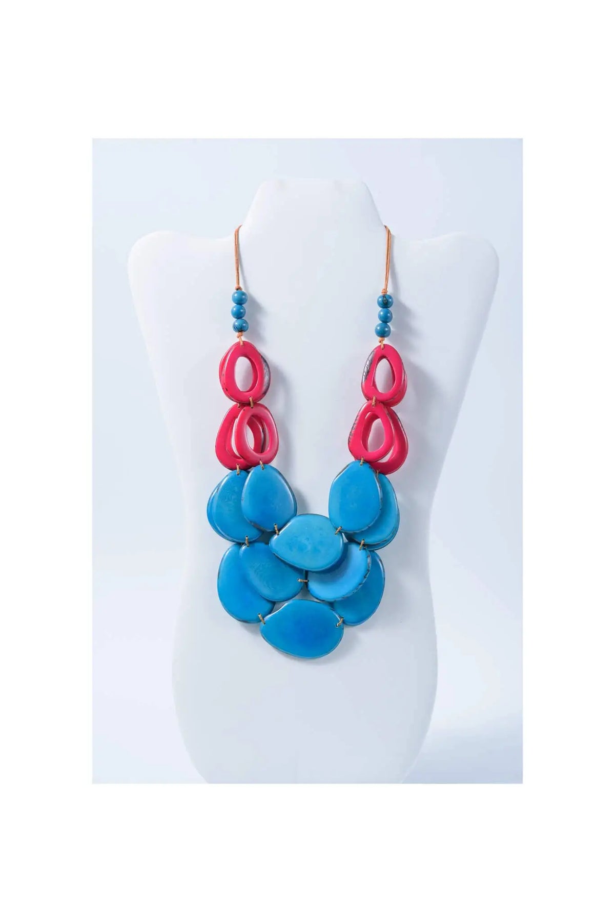 Remy vibrant tagua necklace with bold pink and turquoise resin beads in a layered cascading design