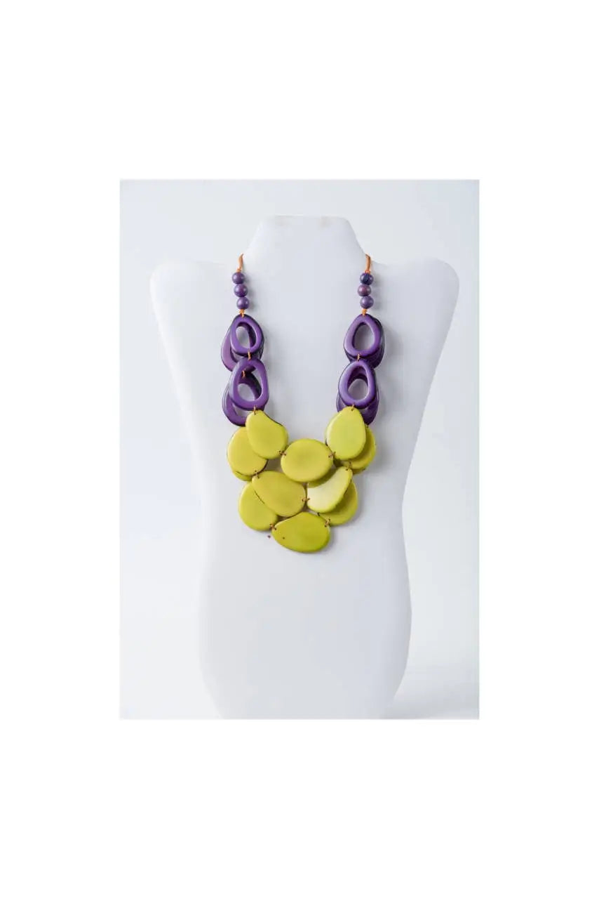 Remy vibrant tagua necklace with layered purple and lime green circular beads and bold modern loop accents