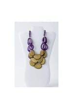 Remy vibrant tagua necklace in olive green and beige with purple and gold layered oval beads and dangling ring accents