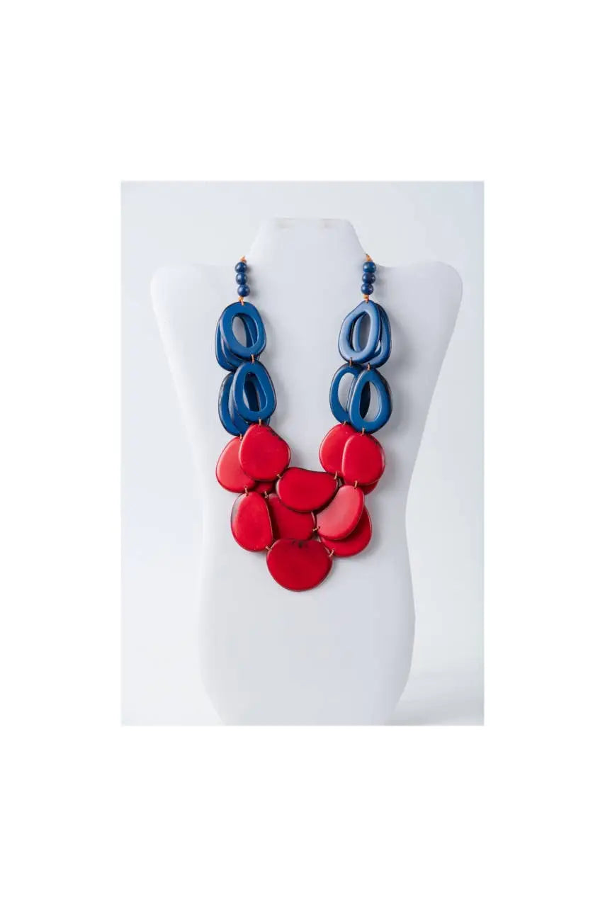 Remy vibrant tagua necklace features glossy oval beads in red and blue layered with loop accents in olive green beige