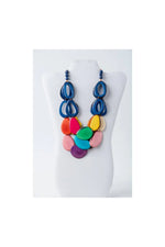 Remy vibrant tagua necklace with loop accents featuring multicolored glossy oval beads in olive green and beige