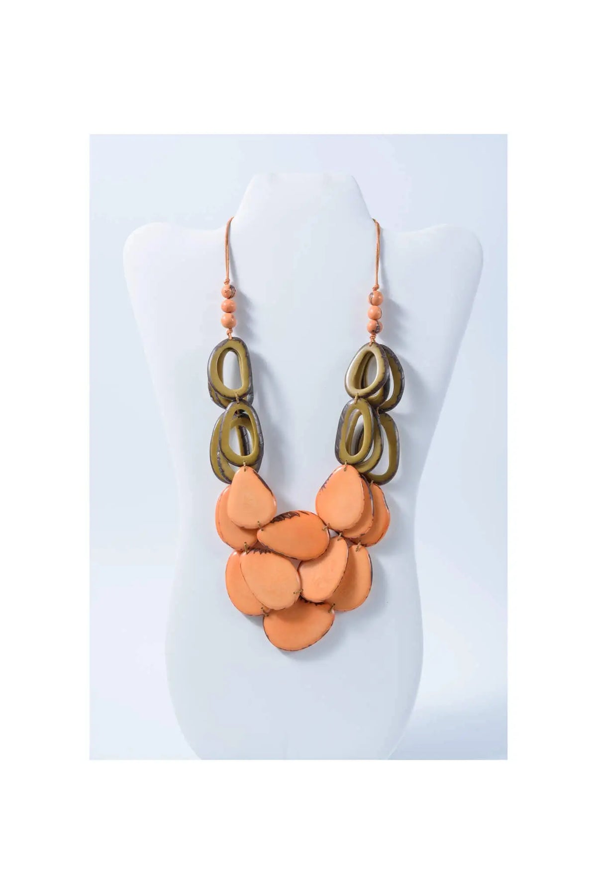 Orange and bronze layered statement necklace with circular and teardrop tagua beads from remy vibrant tagua collection