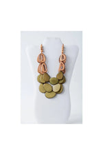 Remy vibrant tagua necklace with olive-green and copper-toned layers featuring bold geometric loop accents in orange brown