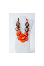 Remy vibrant tagua necklace with layered orange and brown sculptural loop accents in a bold statement design