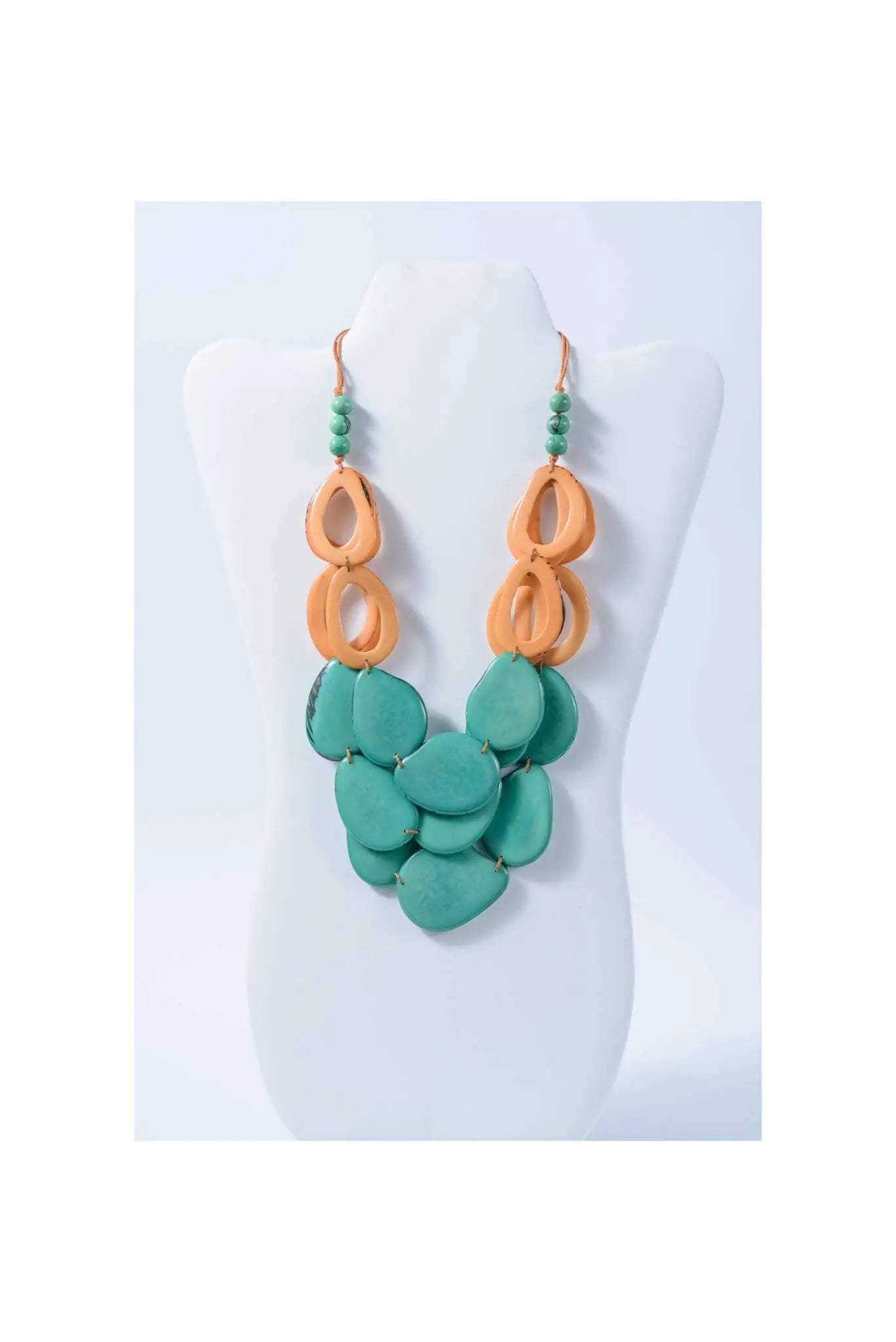 Remy vibrant tagua necklace with loop accents featuring a turquoise and orange layered resin bead design