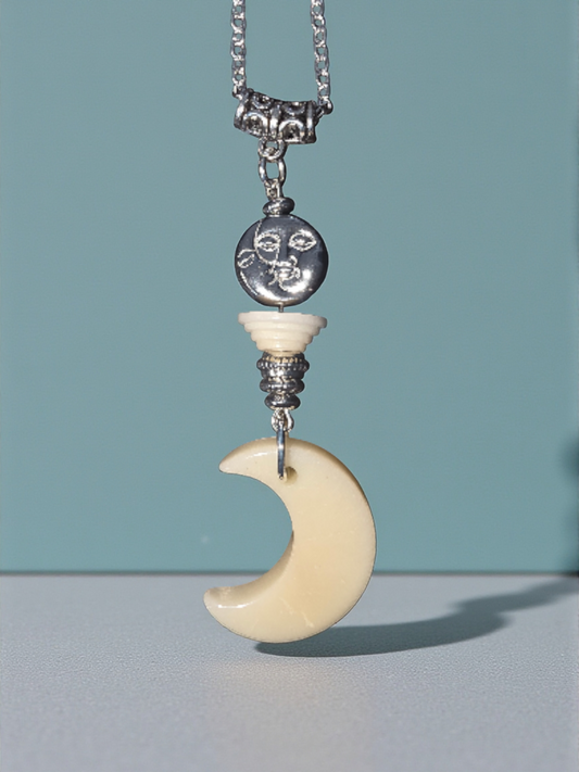 Here we have a cream colored carved Tagua Nut Moon with a silver-tone heavy Sun and Moon Thick Bead, making this vegetable ivory, plastic-free, fair trade necklace all the more fantastic!