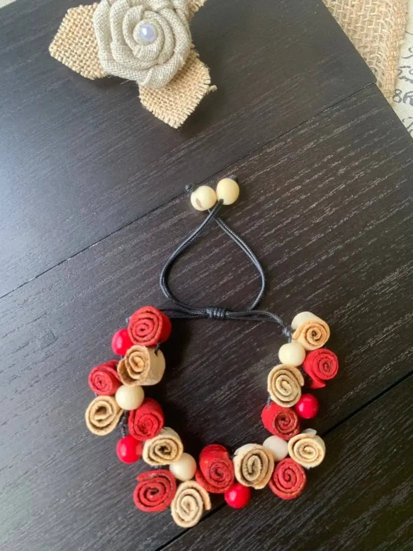 Red and beige rose bracelet with wooden beads and adjustable cord perfect for fall fashion 2025 wearable art accessory