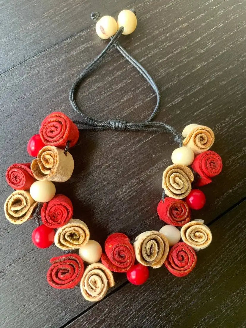 Handmade rose bracelet with rolled fabric roses and beads on adjustable black cord perfect for fall fashion 2025