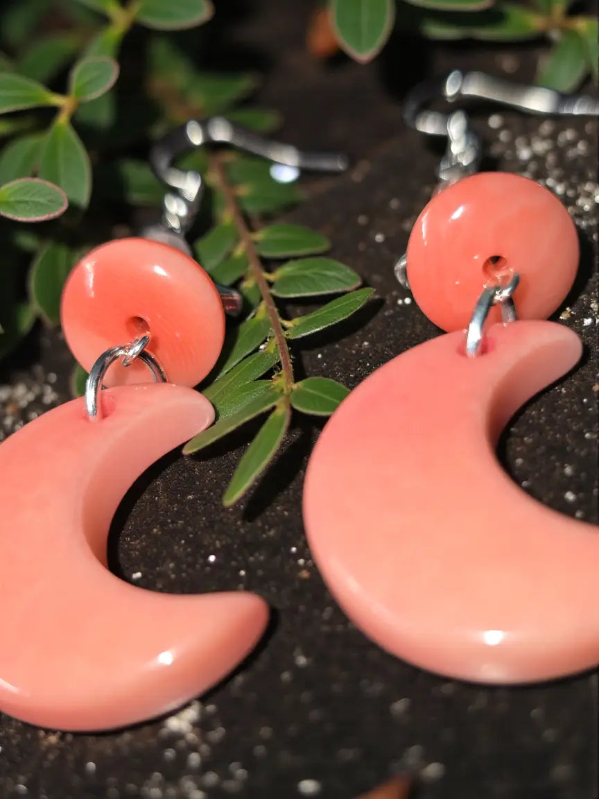 Salmon pink crescent moon carved tagua nut earrings with glossy finish and silver-toned hooks with star beads