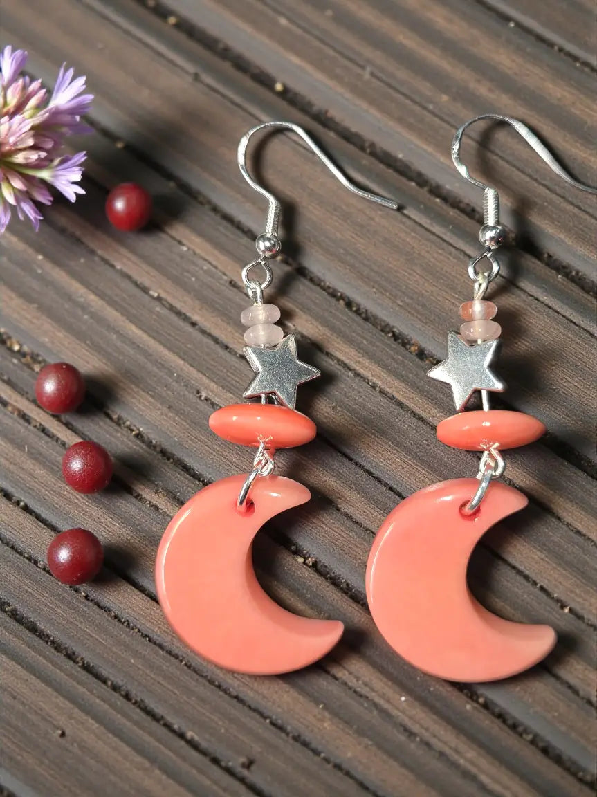 Salmon pink thick moon carved tagua nut earrings with silver star charms and metallic hooks lightweight design
