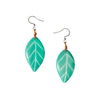 Samira earrings aqua teal leaf shaped resin earrings with white veins and silver hooks attached by brown cord