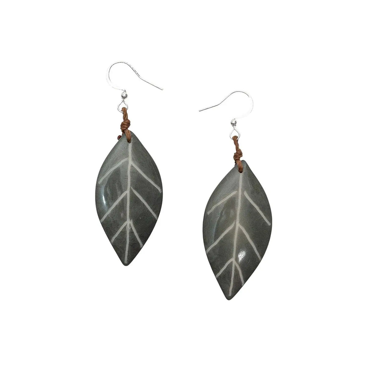 Gray carved leaf tagua nut samira earrings with white veins, brown leather ties on silver hooks fair trade from ecuador
