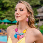 Samira earrings orange featuring a vibrant multi-colored leaf design with a halter-style cord necklace accessory