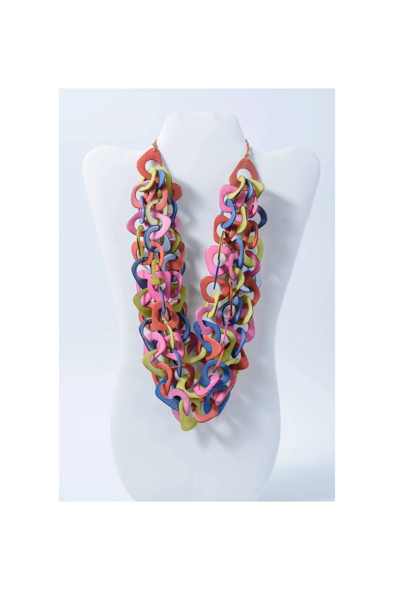 Vibrant scarf tagua necklace with three-stranded chunky chain links in pink orange yellow and blue organic tagua necklace