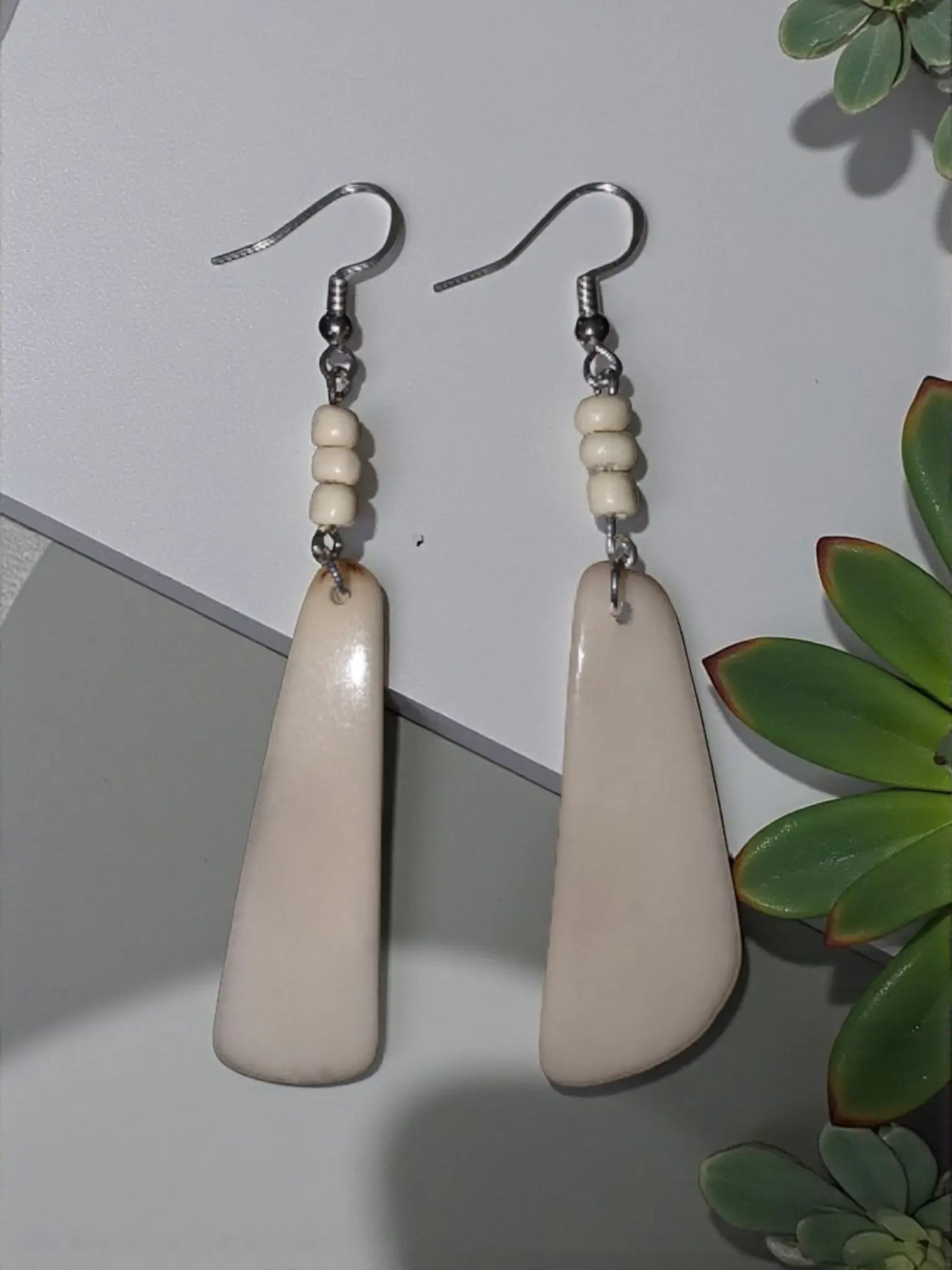Simple cream fan tagua lightweight handmade earrings with cream-colored teardrop matte finish and silver hooks