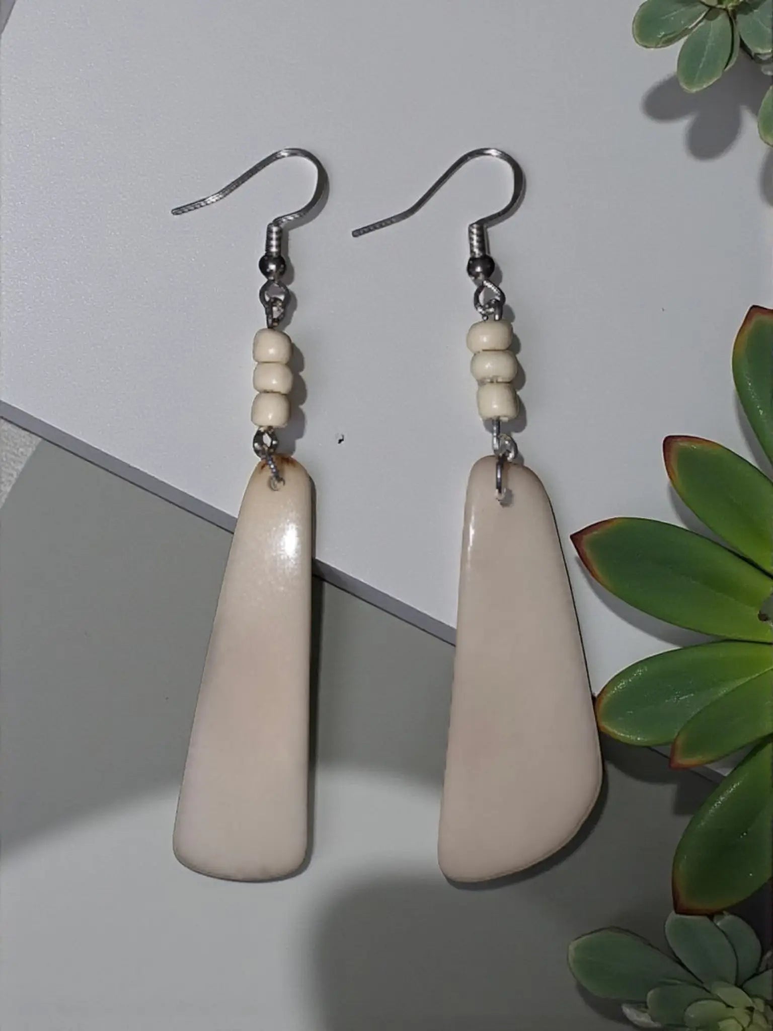 Simple cream fan tagua lightweight handmade earrings with cream-colored teardrop matte finish and silver hooks