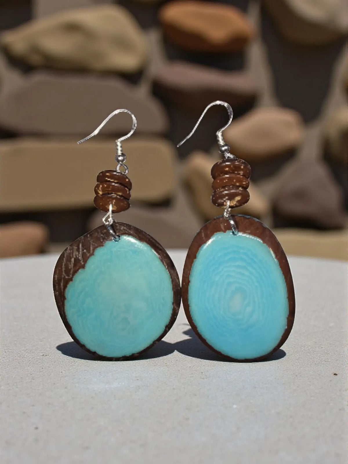 Turquoise and brown wooden disc earrings with natural handcrafted finish in sky blue natural edge lightweight tagua grain design