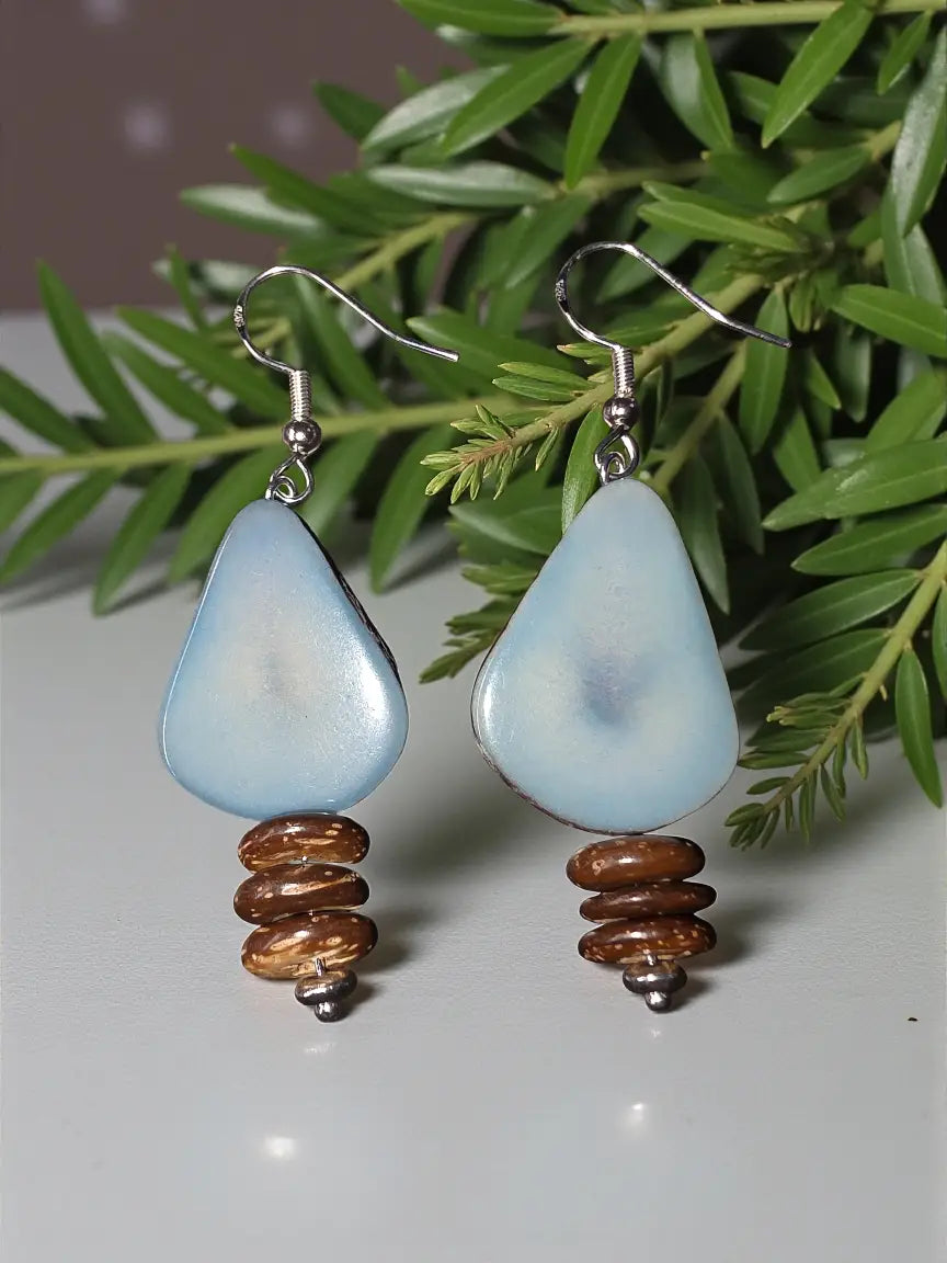Sky blue teardrop tagua nut earrings with glossy finish and stacked forest seed beads below each drop