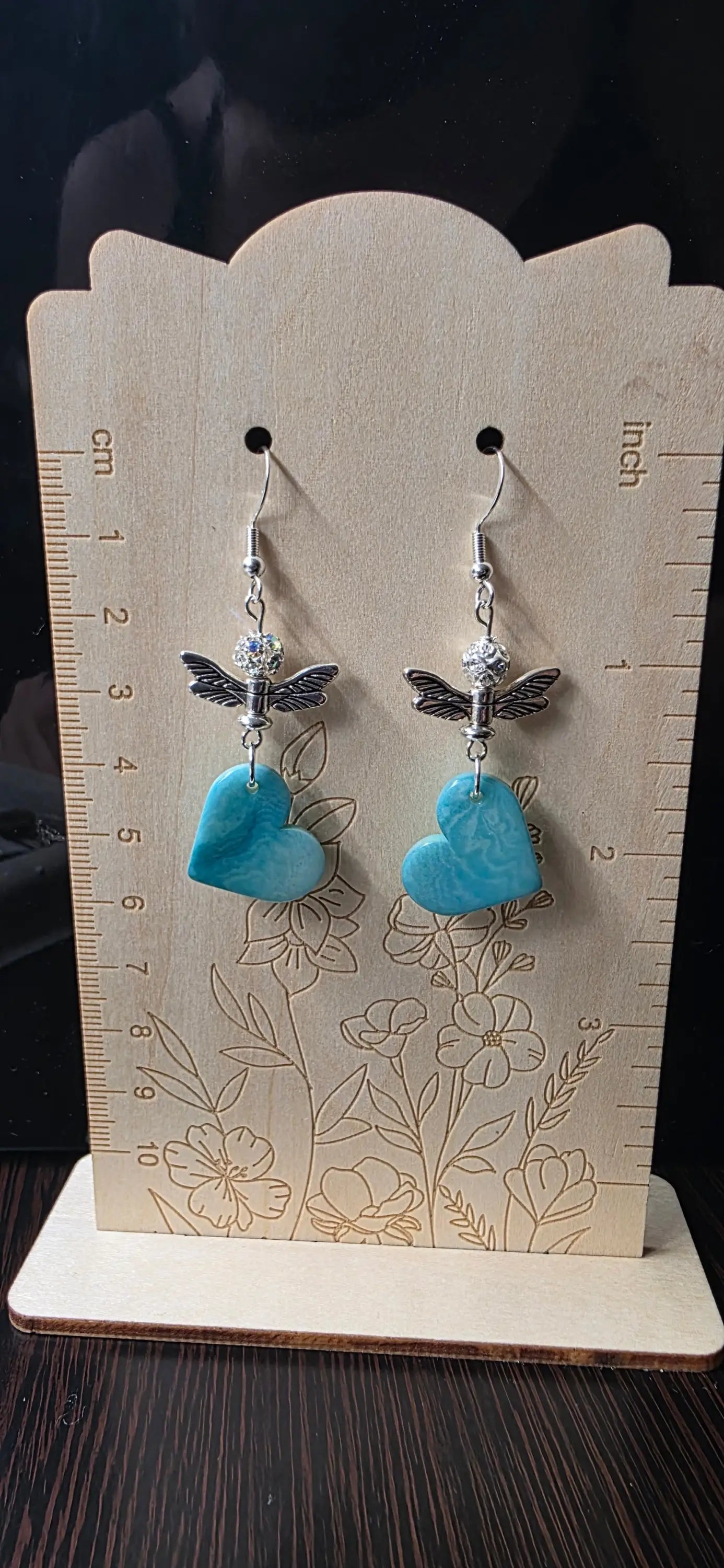 Sky blue heart-shaped tagua vegetable ivory earrings with silver dragonfly charms and crystal accents from the rainforest