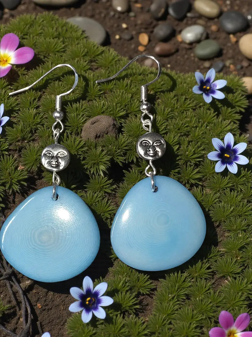Sky blue tagua slice earrings with light blue teardrop shells and silver stainless sun bead charms