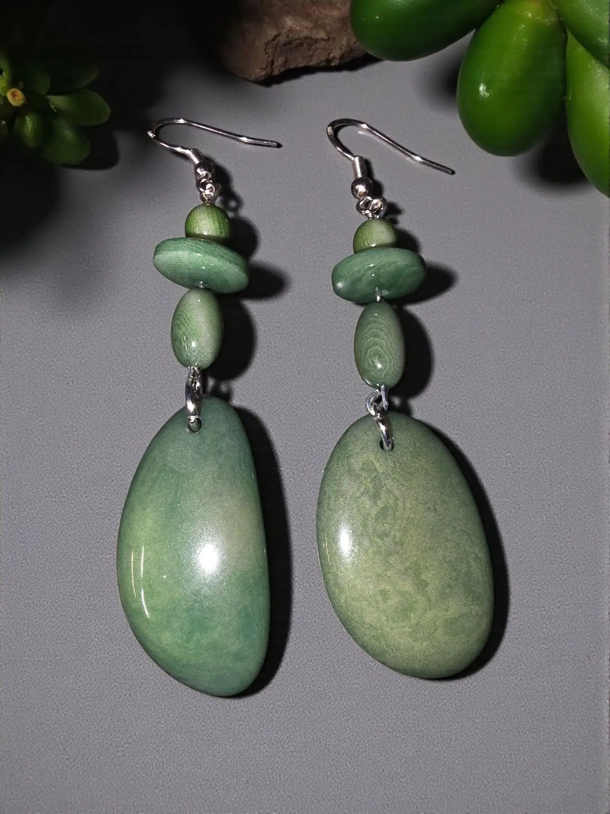 Elegant stunning sage story cut tagua earrings with polished green jade drops and layered matching beads