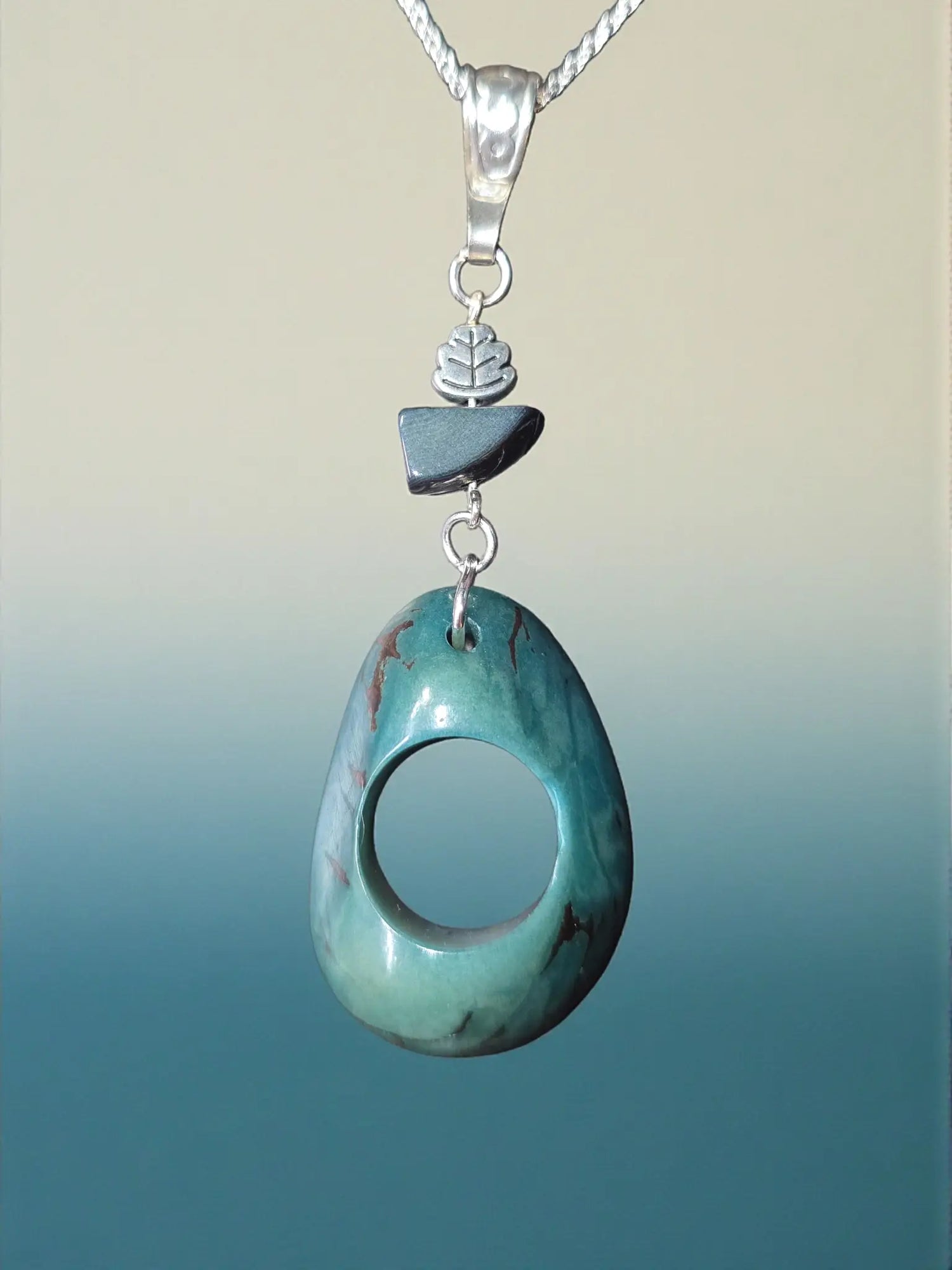Stunning thick carved turquoise colored polished tagua nut necklace with smooth gray and turquoise stone pendant fair trade