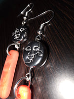 Black oval face pendant earrings with silver hooks and coral peach melon tagua charms sun and moon amulet bead design