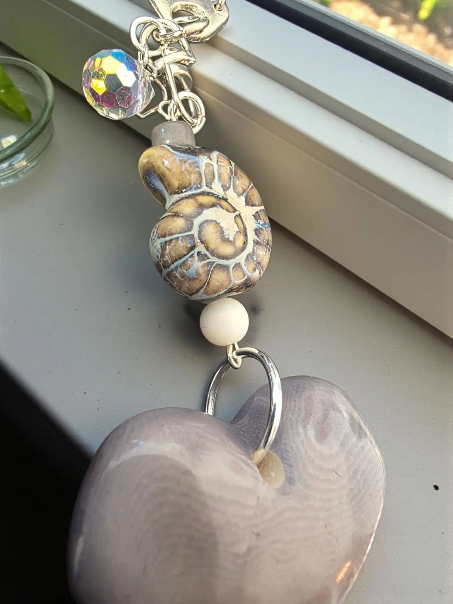 Super thick gray tagua carved heart bag charm with a translucent lavender keychain bead and faceted crystal charm