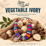 A vibrant handmade rainbow tagua nut necklace with a floral pendant on earthy vegetable ivory beads vegan jewelry
