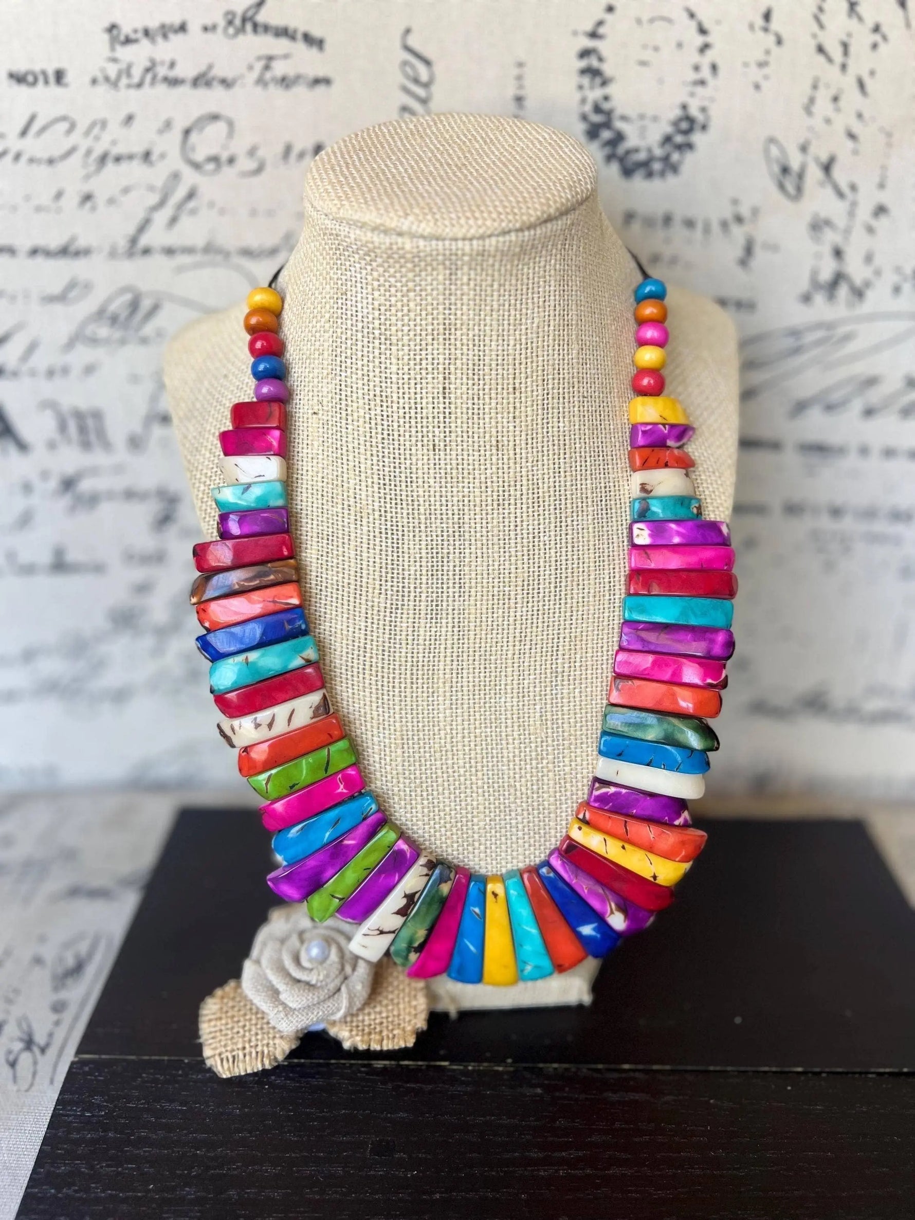 Vibrant tagua nut necklace with multicolored shell beads and textured burlap flower handmade adjustable statement nut necklace