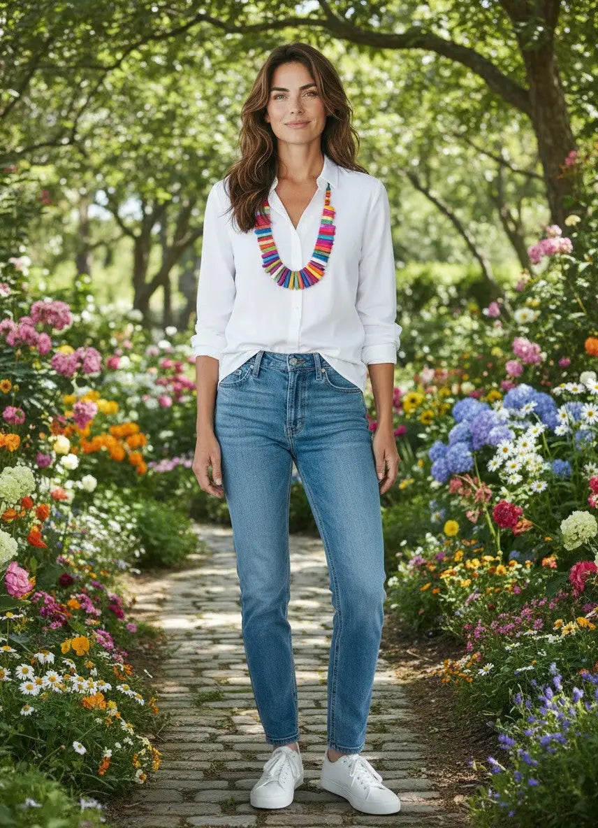 White button-down shirt with rolled sleeves paired with a colorful tagua nut necklace for a bold statement look