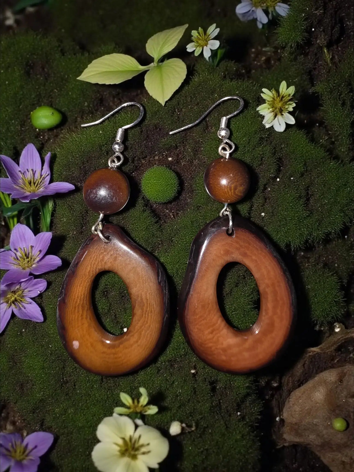 Thick hoop rich brown dangle earrings made of handcrafted wood with natural grain and silver-toned hooks