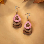 Pink and brown layered teardrop katniss earrings feature carved tagua nut and wooden accents for a natural look