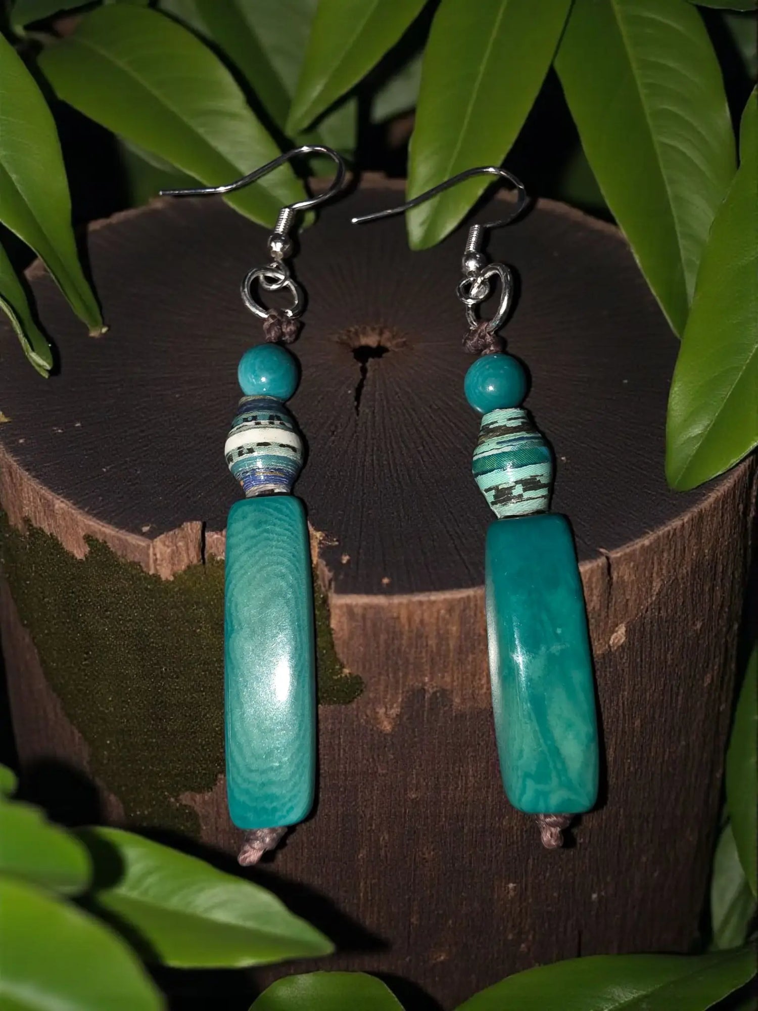 Turquoise colored tagua hand tied baguette earrings with turquoise and white beads and a polished rectangular centerpiece