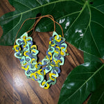 Vibrant three-stranded tagua necklace with interlocking mint green yellow and blue geometric links eco friendly jewelry