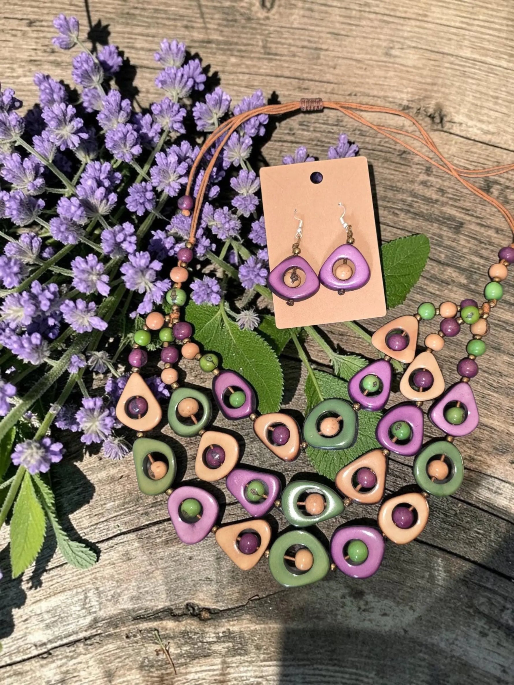 Colorful wild orchid eden three stranded tagua necklace set with purple green and beige geometric beads and earrings