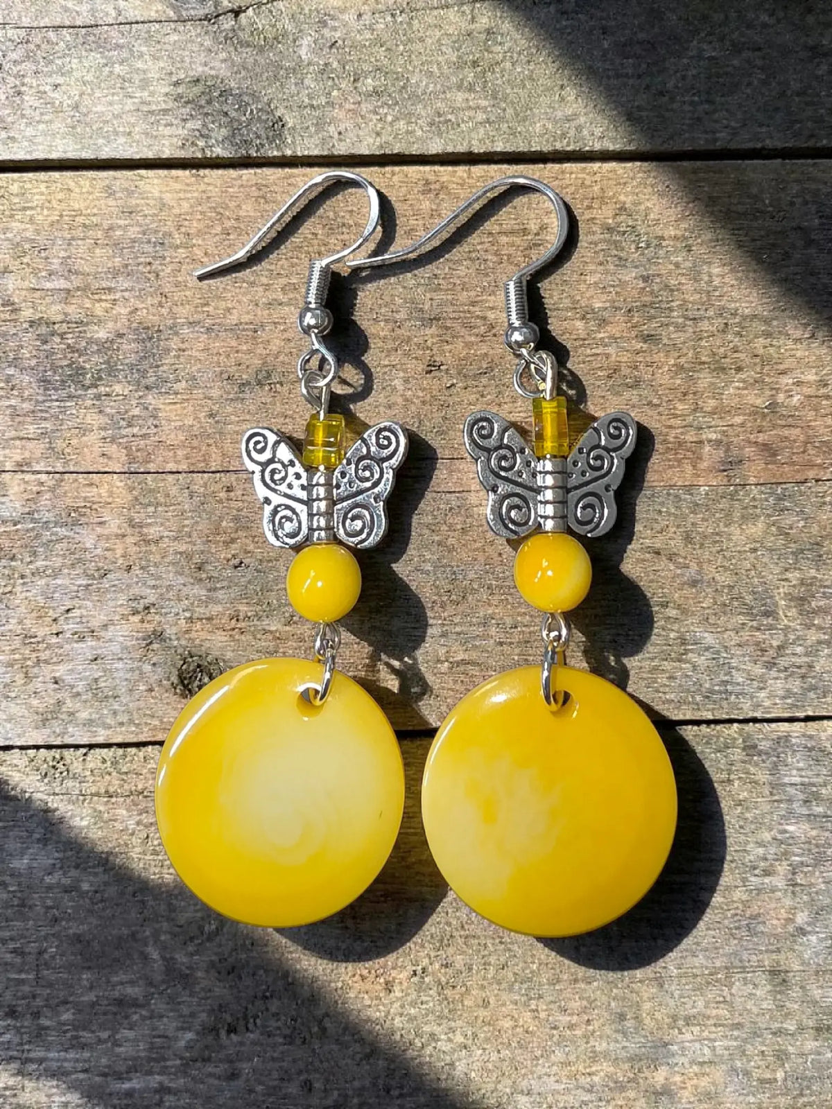 Yellow misty collection vegetable ivory eco-friendly earrings with yellow discs silver butterfly charms and bead