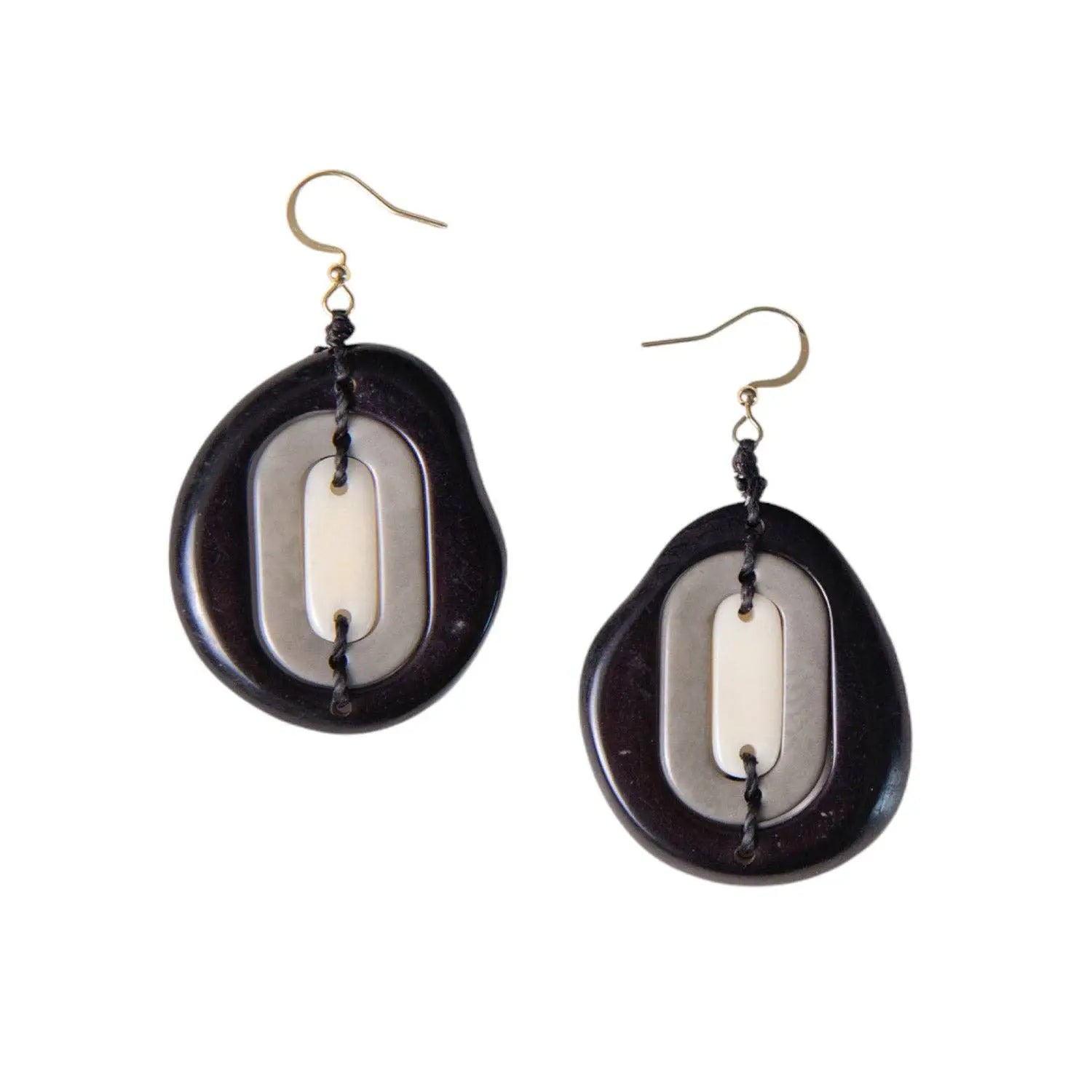 Dark brown yoli earrings with off-white tagua nut centerpiece and black cord detailing in layered oval design