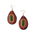 Teardrop-shaped yoli earrings with layered brown tan and green tagua nut resin connected by orange cord